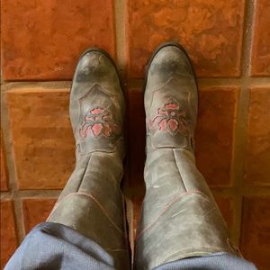 Born distressed leather gray boots with red trim.